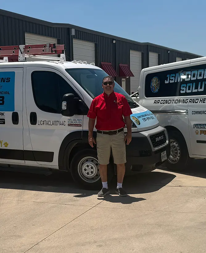 JSM Cooling business owner in front of service vehicles